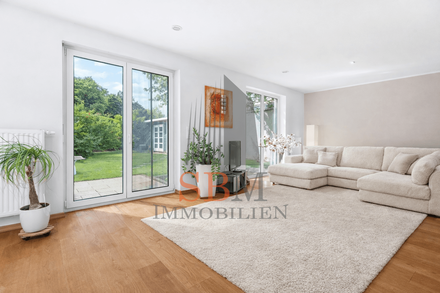 Elegantes Einfamilienhaus mit traumhaftem Garten, Atelier und PV-Anlage - Wohnzimmer